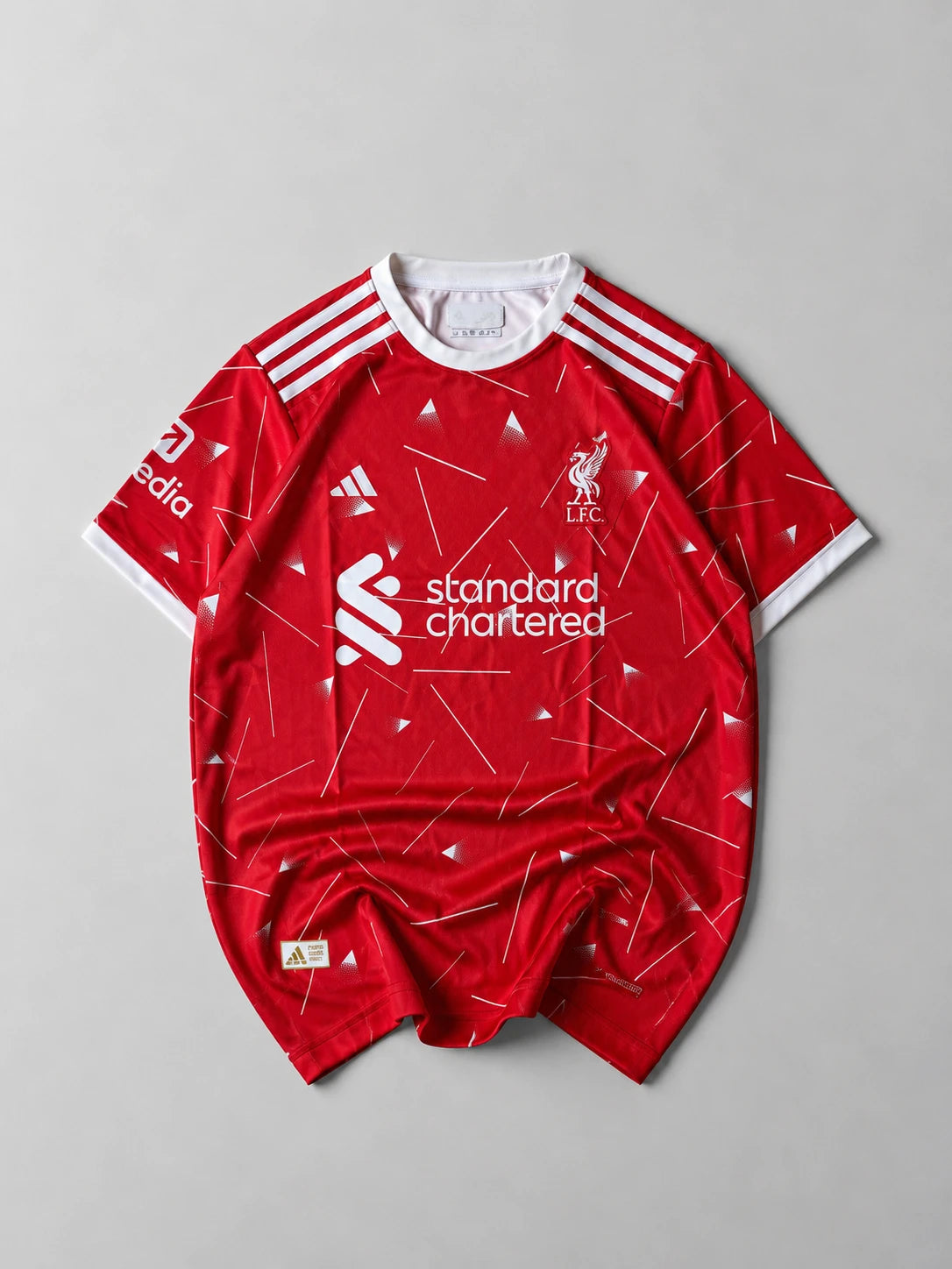 Liverpool 2026-27 Mac Allister jersey front, red kit with embroidered crest